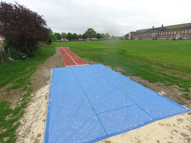 Blue PVC mesh cover with heavy seams to cover a sand pit for long jump and triple jump