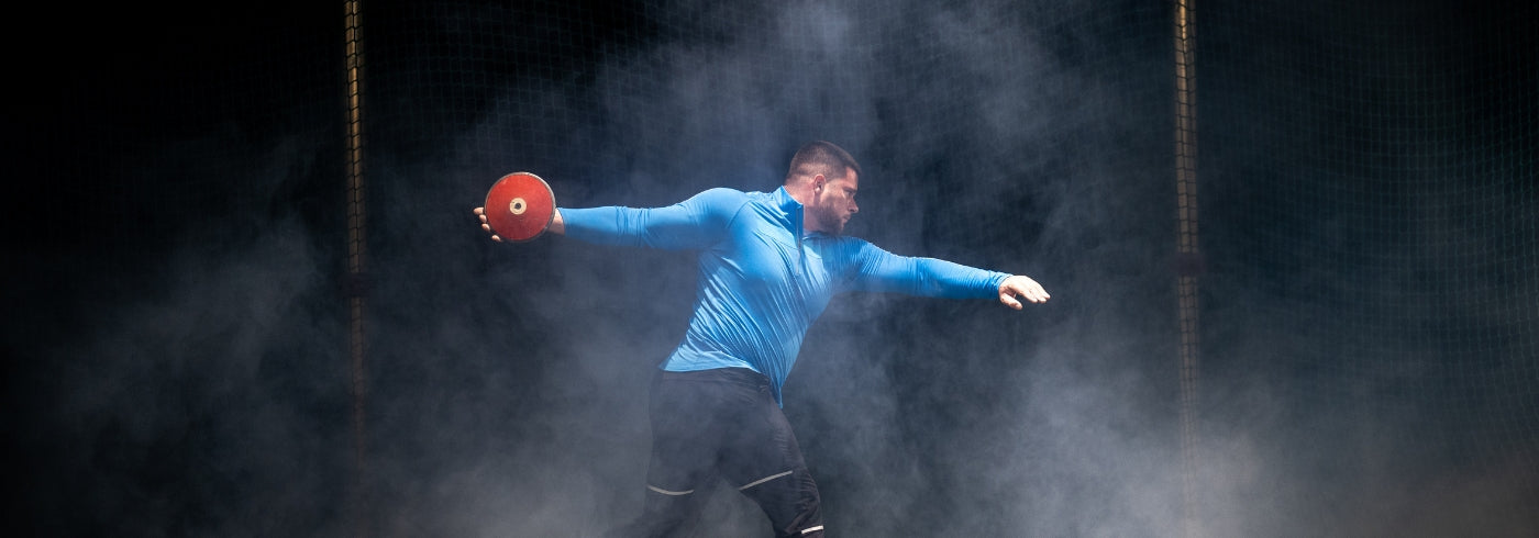 Athlete man throwing discus