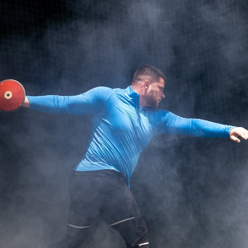 Athlete man throwing discus