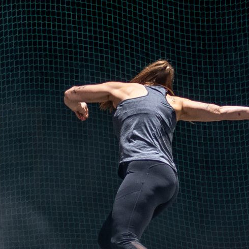 Athlete woman throwing discus