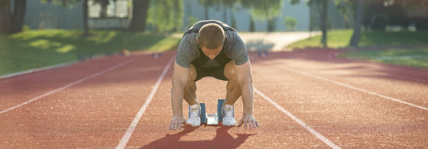 Male Middle Distance Runner Starting Race