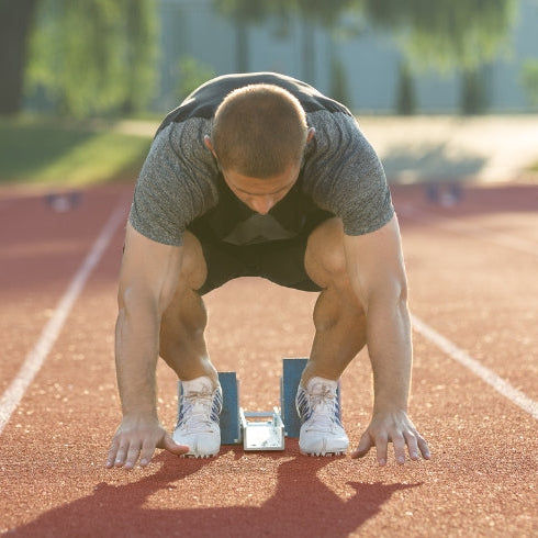Male Middle Distance Runner Starting Race