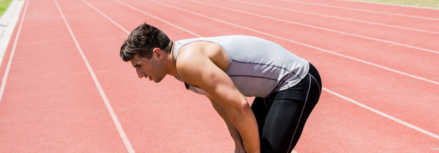 Tired Athlete Standing on Track