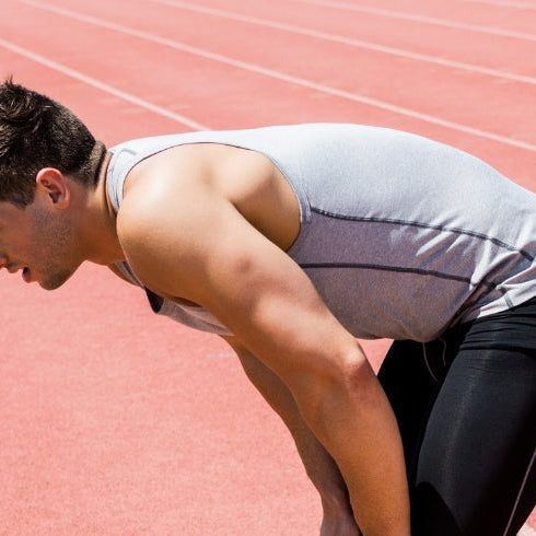 Tired Athlete Standing on Track