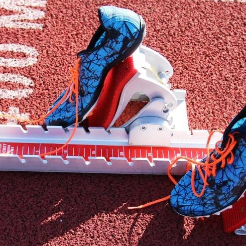 Starting blocks with shoe spikes