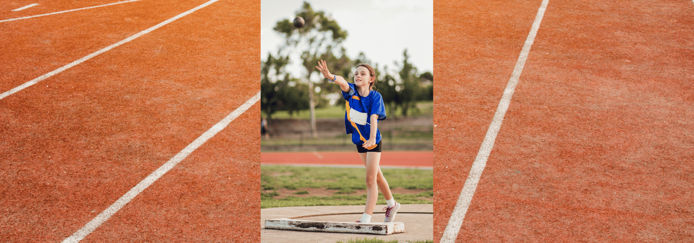Young athlete putting shot