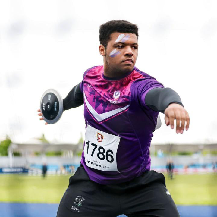 Athlete Josh Douglas throwing a discus
