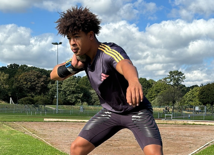 Athlete Olly Coulibali putting shot in a competition