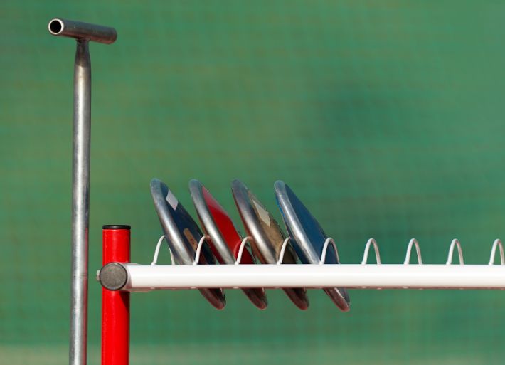 Four discus on a discus storage rack