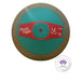 A discus thrower shown from a top-down view on a white background, featuring a metallic bronze outer rim, a teal-green center, and a red label with 'Nordic Sport' branding. A 'World Athletics Certified Product' logo is visible in the bottom right corner.