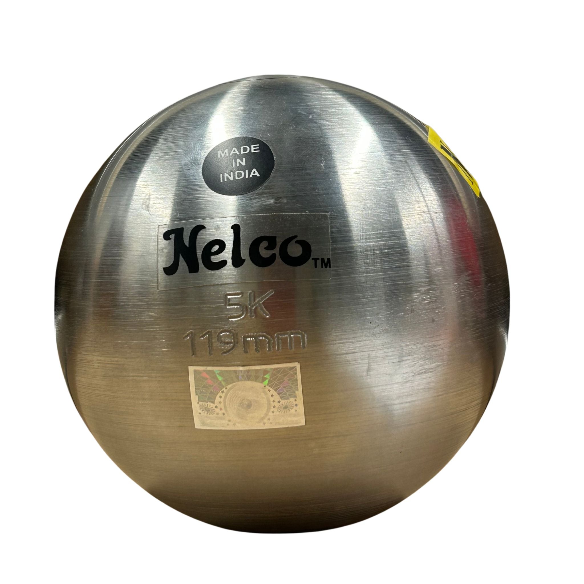 A polished steel throwing ball with a brushed metallic finish, featuring the 'Nelco' brand name, '5K' weight, and '119mm' size printed on the front. A black circular 'MADE IN INDIA' sticker is visible near the top, and a small yellow sticker is on the right edge, all set against a plain white background.