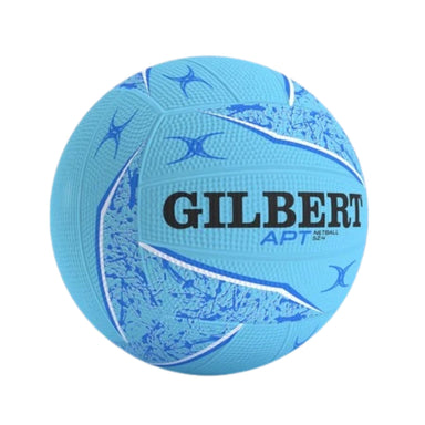 A light blue Gilbert APT netball with textured panels, blue graphic patterns, and black brand lettering, isolated on a white background.