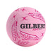 A pink Gilbert APT netball ball with black and pink branding and textured panels, isolated on a white background.