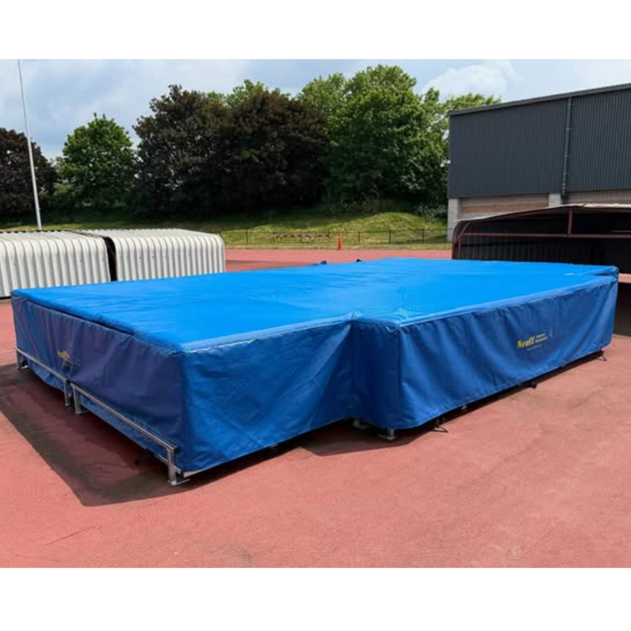 Blue High Jump landing area with Neuff branding on a steel pallet frame base 