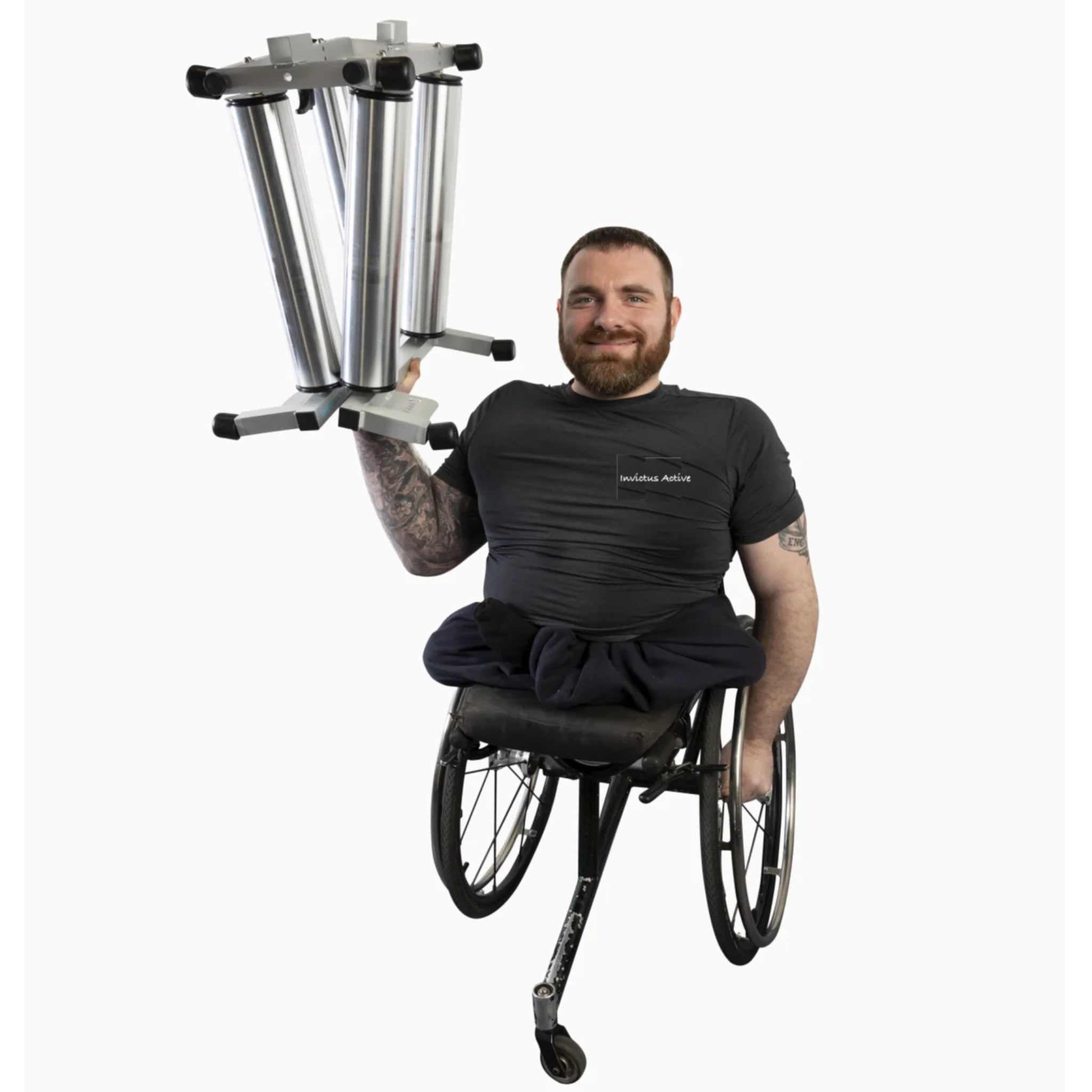 Man in a wheelchair holding the aluminium Invictus Active Race Rollers to indicate its light weight against a white background