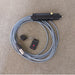 black tube on a grey lead with a black keyring with a red dot on