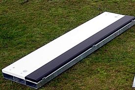 timber board on metal frame.  For use as a long jump or triple jump take off board