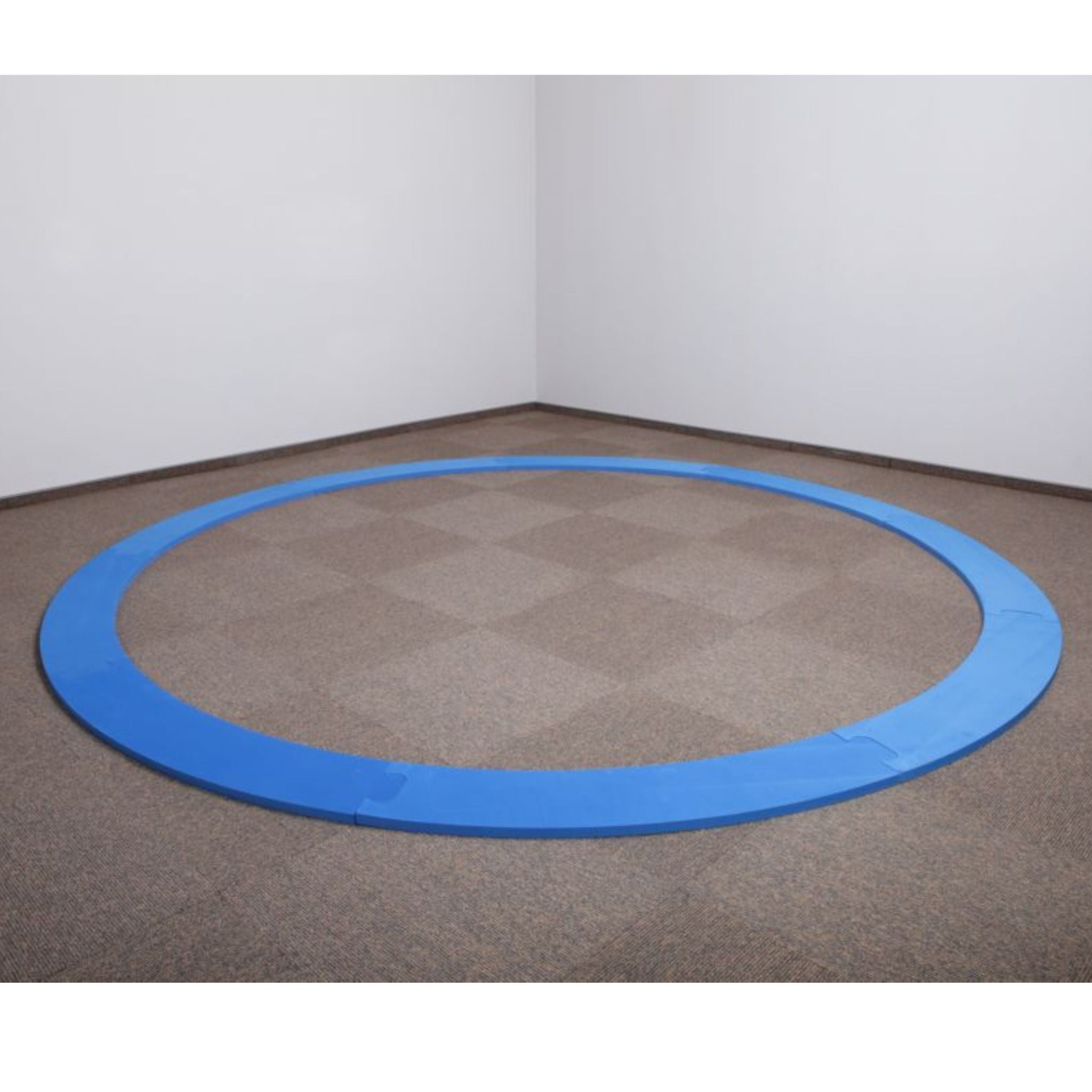 Polanik Foam Discus Training Circle set up on a carpeted gym floor